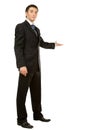 Businessman with arm out in a welcoming gesture Royalty Free Stock Photo