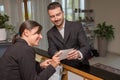 Businessman is arrived in hotel and is checking-in Royalty Free Stock Photo