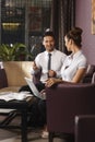 Businessman and assistant working at hotel lobby