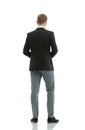 Businessman from the back - looking at something over a white ba