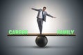 Businessman balancing between career and family in business conc Royalty Free Stock Photo