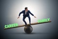 Businessman balancing between career and family in business conc Royalty Free Stock Photo