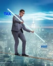 Businessman balancing between debt and tax