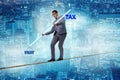 The businessman balancing between debt and tax Royalty Free Stock Photo