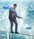 Businessman balancing between debt and tax