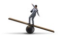 The businessman balancing on seesaw in uncertainty concept Royalty Free Stock Photo