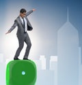 Businessman balancing on top of dice stack in uncertainty concep Royalty Free Stock Photo