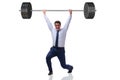 The businessman with barbell in heavy lifting concept