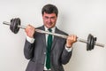 Businessman with barbell is lifting heavy weight