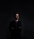 Businessman with beard. Black background with copyspace. Royalty Free Stock Photo