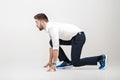 Businessman with beard in white shirt on position of start ready