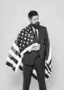 Businessman bearded man in formal suit hold flag USA. Businessman concept. Successful businessman lawyer or politician