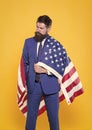 Businessman bearded man in formal suit hold flag USA. Businessman concept. Successful businessman lawyer or politician