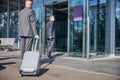 Businessman being assisted by driver at airport during pandemic