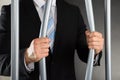 Businessman Bending Bars Of Jail Royalty Free Stock Photo