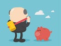 Businessman with big hammer smash piggy bank