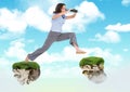 Businessman with binoculars jumping between floating rock platforms in sky Royalty Free Stock Photo