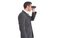 Businessman with binoculars looking on the right