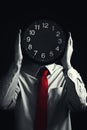 Businessman with black clock, deadline concept Royalty Free Stock Photo