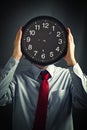 Businessman with black clock, deadline concept Royalty Free Stock Photo