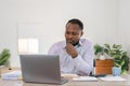 Businessman black man using laptop at home in living room. Happy mature businessman send email and working at home Royalty Free Stock Photo