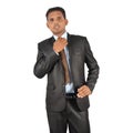 Businessman in black suit adjusting necktie Royalty Free Stock Photo