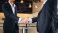 Businessman in black suit handshaking Royalty Free Stock Photo