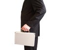 Businessman in black suit holding a white suitcase