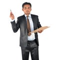 Businessman in black suit with pen and clipboard presenting Royalty Free Stock Photo