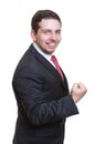 Businessman in black suite is happy Royalty Free Stock Photo