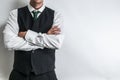 Businessman in black waistcoat vest, white shirt and a tie