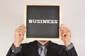 Businessman with a blackboard Royalty Free Stock Photo