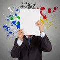 Businessman with blank book and splash colors Royalty Free Stock Photo