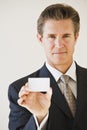 Businessman with blank business card