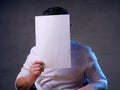 Businessman with Blank Paper Mask Covering His Face Royalty Free Stock Photo