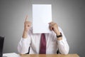 Businessman with Blank Paper Mask Covering His Face Royalty Free Stock Photo