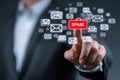 Businessman is blocking spam email by pressing spam button on virtual screen Royalty Free Stock Photo
