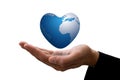 Businessman hand and the earth heart