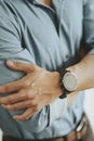 Businessman in a blue shirt wearing a smart watch