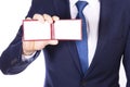 A businessman in a blue suit shows a business card or pass, a man holds a pass in his hands, an identity card Royalty Free Stock Photo