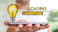 Businessman holding loading sketch over mobile phone