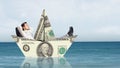 Businessman in boat made of dollar banknote