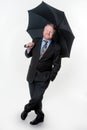 Businessman with bowler hat & brolly - on white Royalty Free Stock Photo