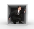 Businessman in a box Royalty Free Stock Photo