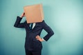 Businessman with a box on his head is cofused Royalty Free Stock Photo