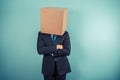 Businessman with a box on his head Royalty Free Stock Photo