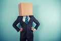 Businessman with a box on his head Royalty Free Stock Photo