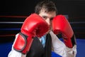 Businessman is boxing and fighting in ring Royalty Free Stock Photo