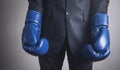 Businessman in boxing gloves. Business, Power, Sport