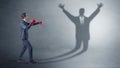 Businessman fighting with a disarmed businessman shadow Royalty Free Stock Photo